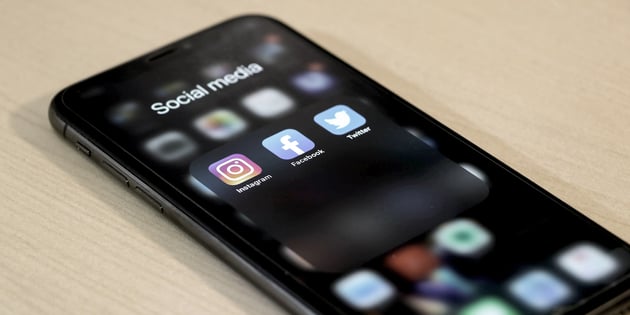 Social media apps; Instagram, Facebook, Twitter on an iPhone